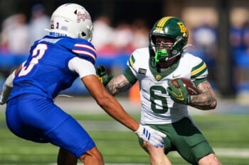 Oct 24, 2026; Lawrence, Kansas, USA; Baylor Bears wide receiver Gavin Freeman (6) runs with the ball against Kansas Jayhawks safety Corey Gordon (3) during the first half at David Booth Kansas Memorial Stadium. Mandatory Credit: Jay Biggerstaff-Imagn Images