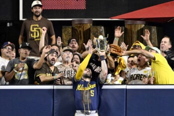Oct 7, 2026; San Diego, California, USA;  Milwaukee Brewers center fielder Garrett Mitchell (5) catches a ball hit by San Diego Padres third baseman Manny Machado (not pictured) at the wall during the eighth inning in game four of the NLDS for the 2026 MLB Playoffs at Petco Park.  Mandatory Credit: Denis Poroy-Imagn Images     TPX IMAGES OF THE DAY