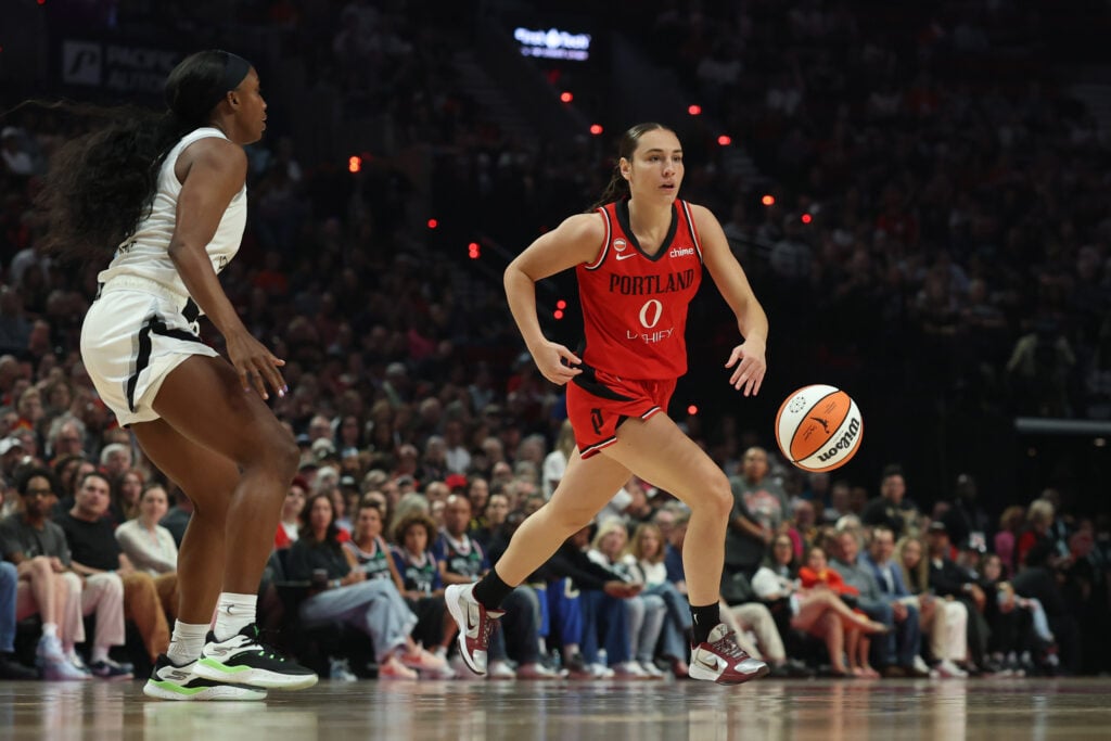 Jul 9, 2026; Portland, Oregon, USA; Portland Fire guard Carla Leite (0) controls the ball during the first half against the Las Vegas Aces at Moda Center. Mandatory Credit: Soobum Im-Imagn Images