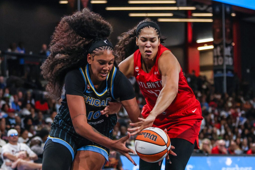 Jul 19, 2026; College Park, Georgia, USA; Atlanta Dream guard Rhyne Howard (10) reacts for the ball against Atlanta Dream forward Brionna Jones (42) during the third quarter at Gateway Center Arena at College Park. Mandatory Credit: Jordan Godfree-Imagn Images