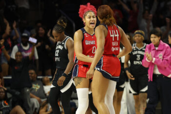 Jul 22, 2026; Washington, District of Columbia, USA; Washington Mystics center Shakira Austin (0) celebrates with Mystics forward Kiki Iriafen (44) after their game against the Las Vegas Aces at CareFirst Arena. Mandatory Credit: Geoff Burke-Imagn Images
