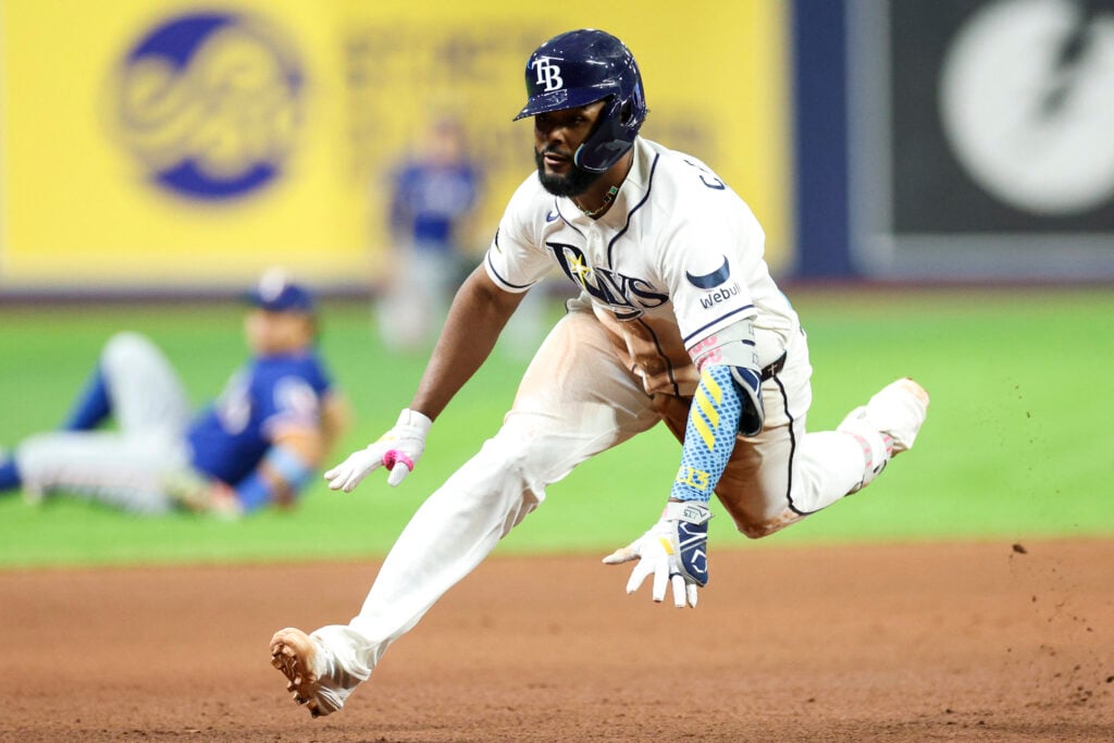 Jul 28, 2026; St. Petersburg, Florida, USA; Tampa Bay Rays third baseman Junior Caminero (13) slides into third base on an rbi triple against the Texas Rangers in the sixth inning at Tropicana Field. Mandatory Credit: Nathan Ray Seebeck-Imagn Images