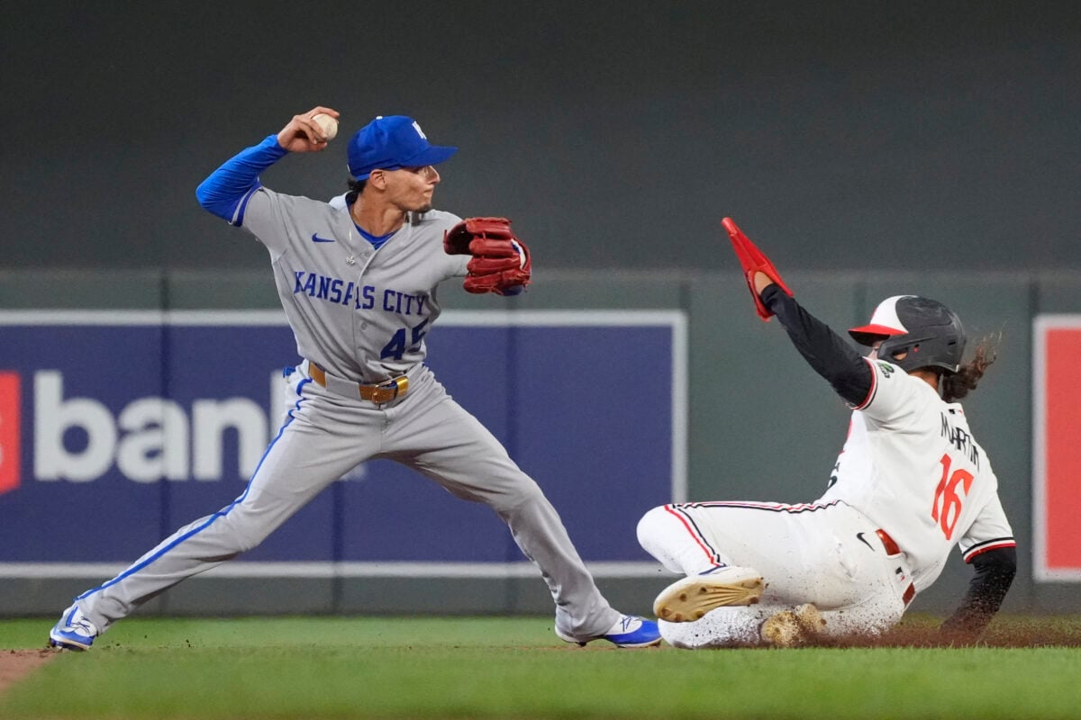 Jul 28, 2026; Minneapolis, Minnesota, USA; Kansas City Royals shortstop Andrew Velazquez (45) forces out Minnesota Twins pinch runner Austin Martin (16) and turns a double play on a ball hit by second baseman Kody Clemens (not pictured) in the eighth inning at Target Field. Mandatory Credit: Bruce Kluckhohn-Imagn Images