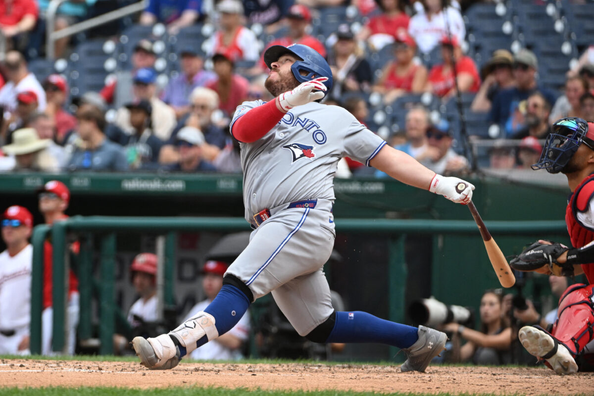 Jul 29, 2026; Washington, District of Columbia, USA; Toronto Blue Jays catcher Alejandro Kirk (30) singles against the Washington Nationals during the seventh inning at Nationals Park. Mandatory Credit: Brad Mills-Imagn Images