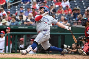 Jul 29, 2026; Washington, District of Columbia, USA; Toronto Blue Jays catcher Alejandro Kirk (30) singles against the Washington Nationals during the seventh inning at Nationals Park. Mandatory Credit: Brad Mills-Imagn Images