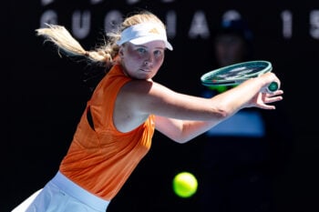 Jan 23, 2026; Melbourne, Victoria, Australia; Clara Tauson of Denmark in action against Victoria Mboko of Canada in the third round of the women’s singles at the Australian Open at John Cain Arena in Melbourne Park. Mandatory Credit: Mike Frey-Imagn Images