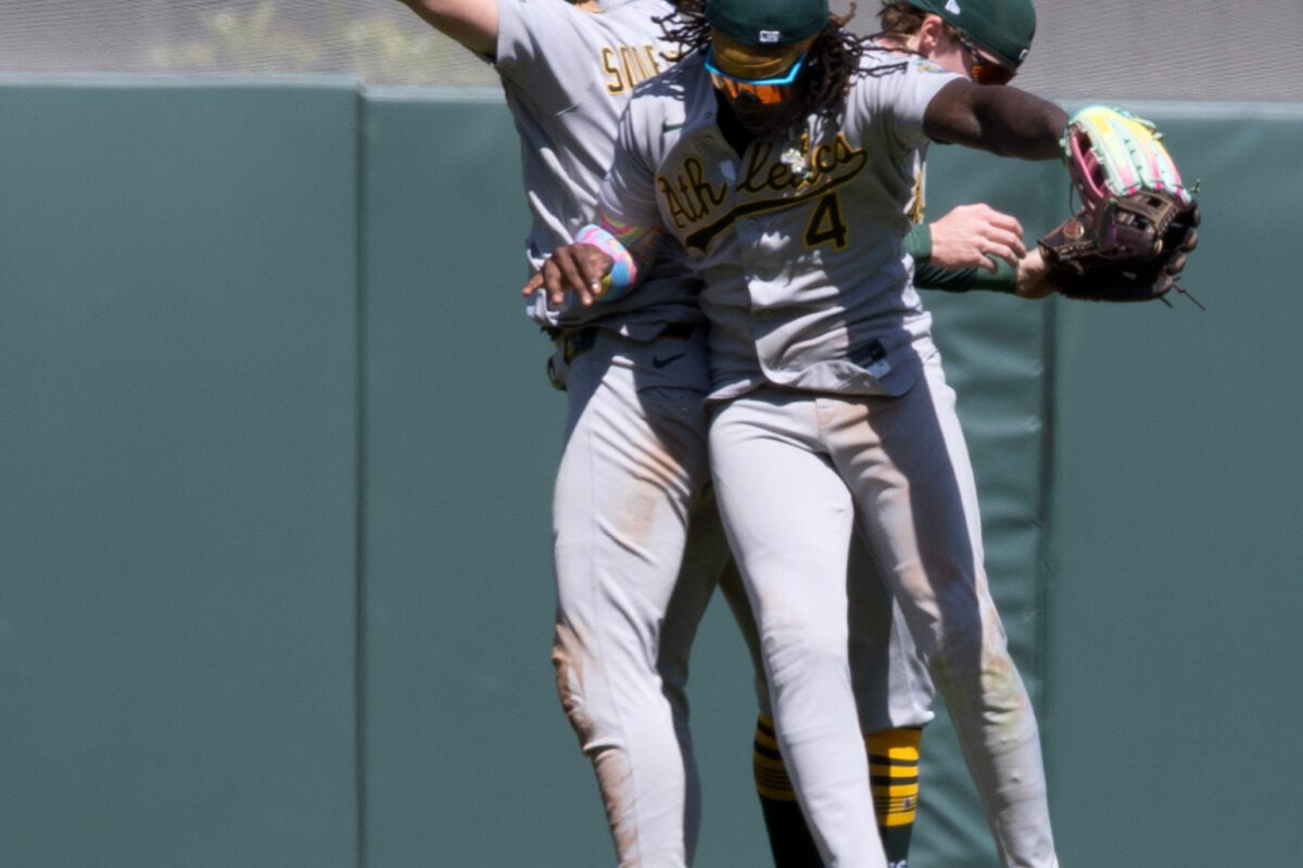 Jun 25, 2026; San Francisco, California, USA; Athletics outfielders Tyler Soderstrom (21), Lawrence Butler (4) and Henry Bolte (33) celebrate their 9-6 victory over the San Francisco Giants at Oracle Park. Mandatory Credit: D. Ross Cameron-Imagn Images