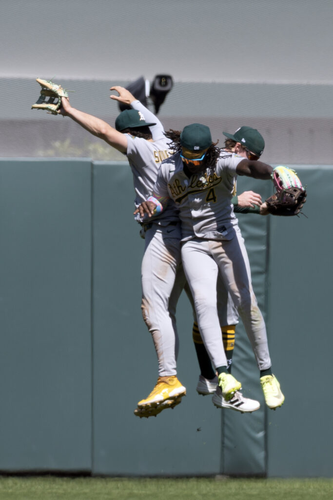 Jun 25, 2026; San Francisco, California, USA; Athletics outfielders Tyler Soderstrom (21), Lawrence Butler (4) and Henry Bolte (33) celebrate their 9-6 victory over the San Francisco Giants at Oracle Park. Mandatory Credit: D. Ross Cameron-Imagn Images