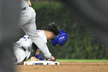 Jul 20, 2026; Chicago, Illinois, USA;  Chicago Cubs right fielder Seiya Suzuki (27) loses his helmet after being picked off on a steal during the fifth inning against the Detroit Tigers at Wrigley Field. Mandatory Credit: Matt Marton-Imagn Images
