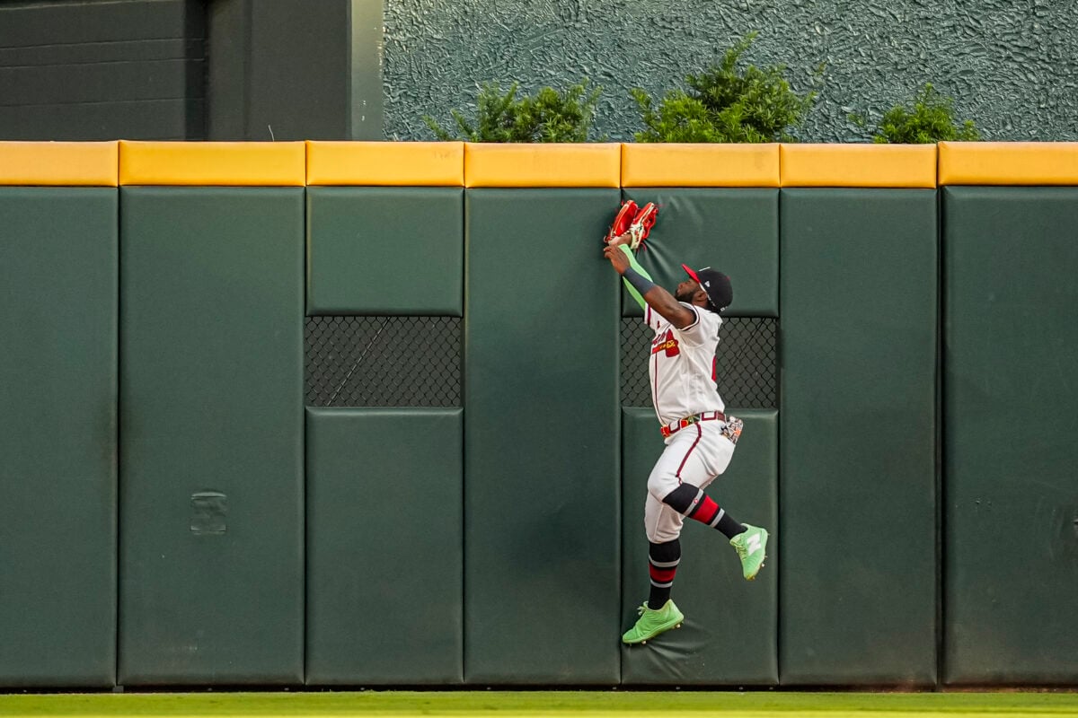 Jul 21, 2026; Cumberland, Georgia, USA; Atlanta Braves center fielder Michael Harris II (23) makes a running catch on a fly ball hit by San Diego Padres shortstop Xander Bogaerts (2) during the second inning at Truist Park. Mandatory Credit: Dale Zanine-Imagn Images