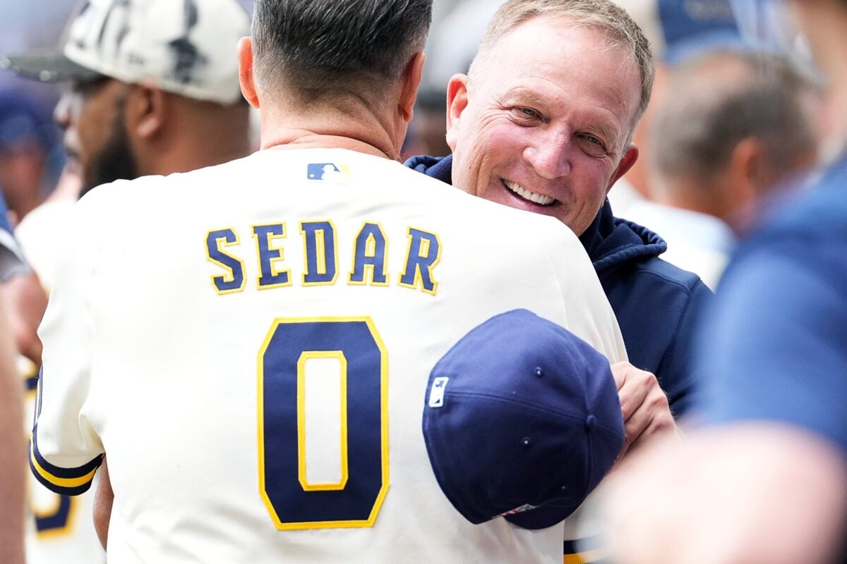 Milwaukee Brewers manager Pat Murphy (49) greets former baseball coach Ed Sedar (0) before the start of the Milwaukee Brewers and Colorado Rockies game at American Family Field in Milwaukee, Wisconsin on July 24, 2026.