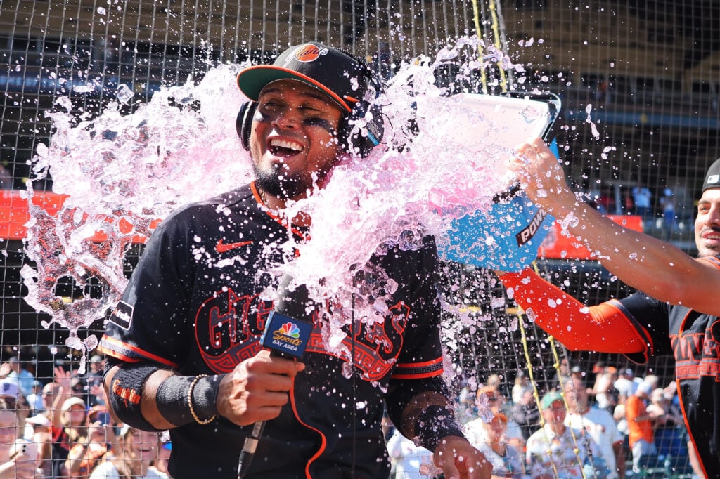 Jul 25, 2026; San Francisco, California, USA; San Francisco Giants second baseman Luis Arraez (1) is dunked with a Powerade bucket by shortstop Willy Adames (2) after a win against the Los Angeles Angels at Oracle Park. Mandatory Credit: Kelley L Cox-Imagn Images