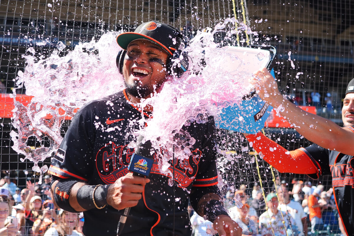 Jul 25, 2026; San Francisco, California, USA; San Francisco Giants second baseman Luis Arraez (1) is dunked with a Powerade bucket by shortstop Willy Adames (2) after a win against the Los Angeles Angels at Oracle Park. Mandatory Credit: Kelley L Cox-Imagn Images