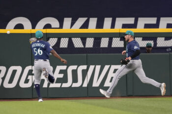 Jul 25, 2026; Arlington, Texas, USA; Seattle Mariners left fielder Randy Arozarena (56) and center fielder Luke Raley (20) chase the double hit by Texas Rangers left fielder Alejandro Osuna (19) during the eighth inning at Globe Life Field. Mandatory Credit: Jim Cowsert-Imagn Images