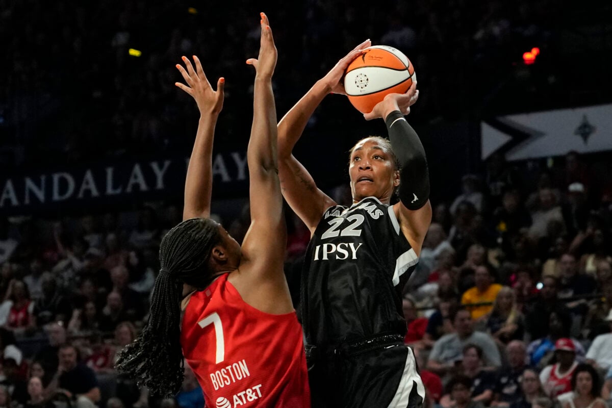 Jul 12, 2026; Las Vegas, Nevada, USA; Las Vegas Aces center A'ja Wilson (22) shoots the ball against Indiana Fever center-forward Aliyah Boston (7) during the third quarter of a WNBA basketball game at Michelob Ultra Arena. Mandatory Credit: Lucas Peltier-Imagn Images