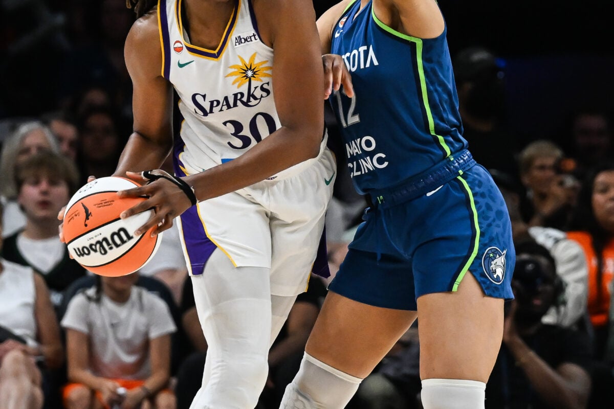 Jul 15, 2026; Minneapolis, Minnesota, USA; Los Angeles Sparks forward Nneka Ogwumike (3) is defended by Minnesota Lynx forward Nia Coffey (12) during the fourth quarter at Target Center. Mandatory Credit: Jeffrey Becker-Imagn Images