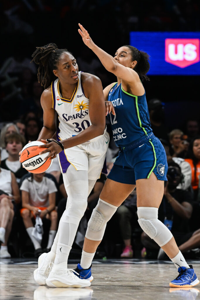 Jul 15, 2026; Minneapolis, Minnesota, USA; Los Angeles Sparks forward Nneka Ogwumike (3) is defended by Minnesota Lynx forward Nia Coffey (12) during the fourth quarter at Target Center. Mandatory Credit: Jeffrey Becker-Imagn Images