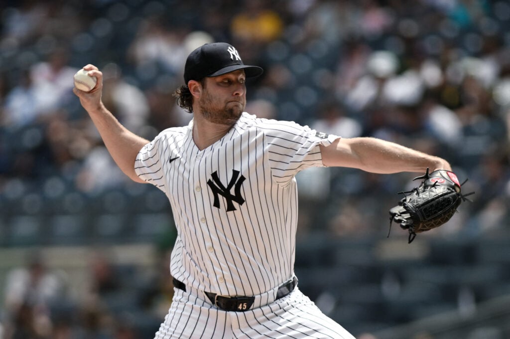 Jul 22, 2026; Bronx, New York, USA; New York Yankees pitcher Gerrit Cole (45) throws a pitch against the Pittsburgh Pirates during the first inning at Yankee Stadium. Mandatory Credit: John Jones-Imagn Images