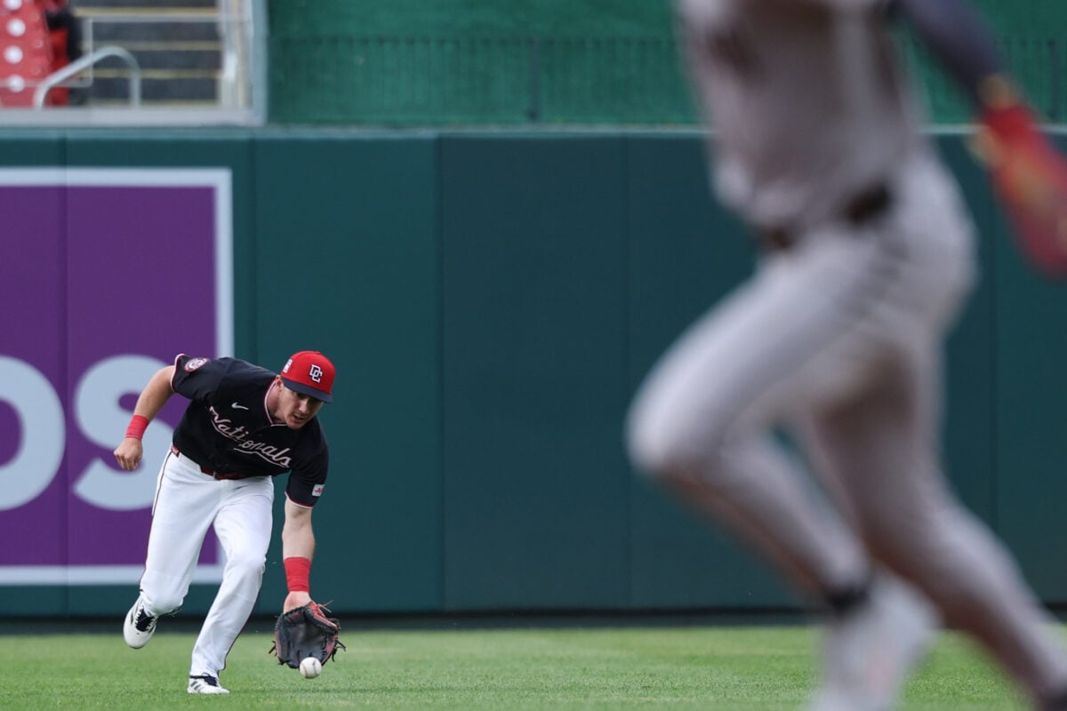 Jul 24, 2026; Washington, District of Columbia, USA; Washington Nationals center fielder Jacob Young (30) fields a single by Arizona Diamondbacks catcher Gabriel Moreno (not pictured) as ] Diamondbacks right fielder Corbin Carroll (7) advances to third base during the first inning at Nationals Park. Mandatory Credit: Geoff Burke-Imagn Images