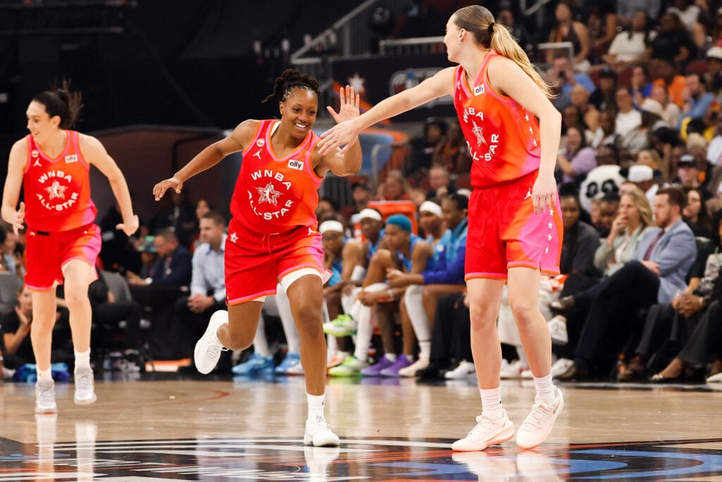 Jul 25, 2026; Chicago, Illinois, USA; Team Coop guard Kelsey Mitchell (0) high fives guard Paige Bueckers (5) in the second half against Team Spoon  during the 2026 WNBA All Star Game at United Center. Mandatory Credit: Kamil Krzaczynski-Imagn Images