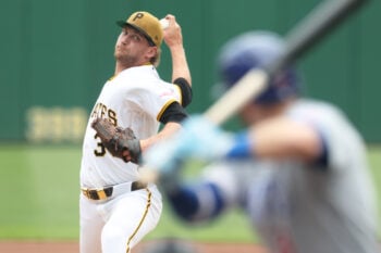 Jul 26, 2026; Pittsburgh, Pennsylvania, USA;  Pittsburgh Pirates starting pitcher Braxton Ashcraft (35) delivers a pitches o Chicago Cubs left fielder Ian Happ (8) during the first inning at PNC Park. Mandatory Credit: Charles LeClaire-Imagn Images