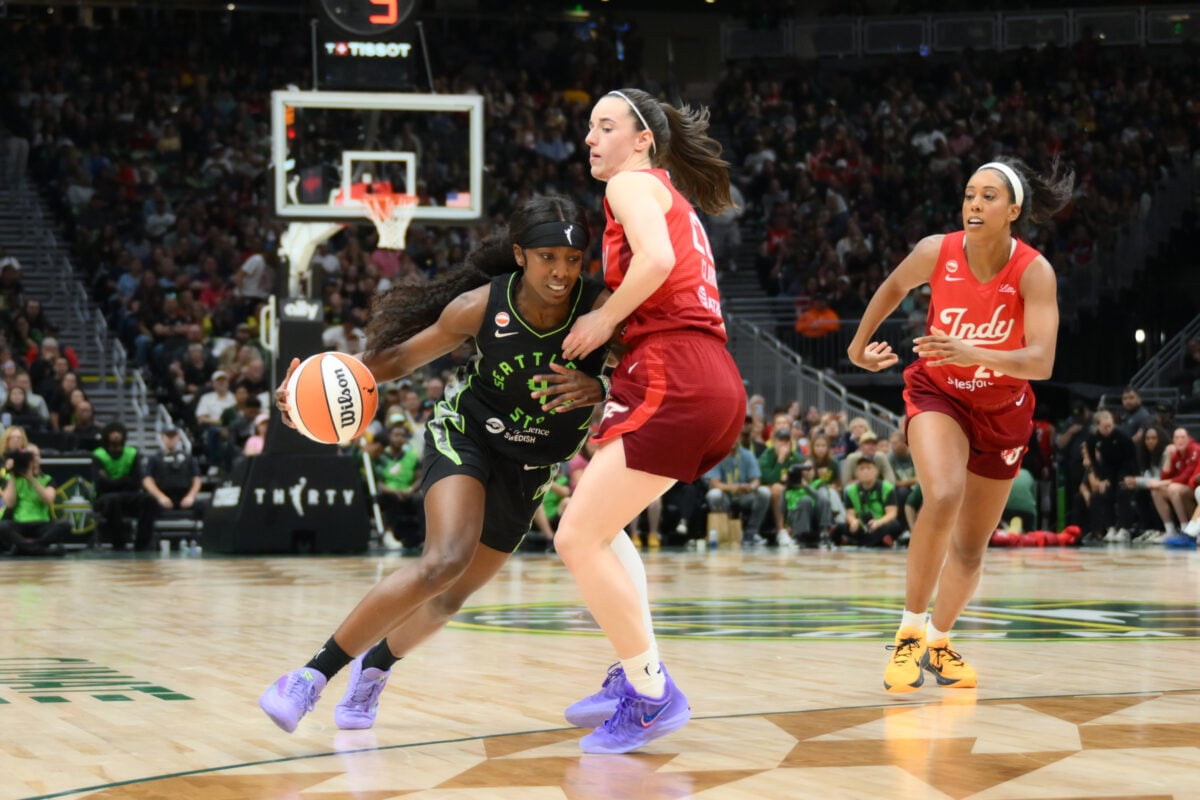 Jul 28, 2026; Seattle, Washington, USA; Seattle Storm guard Flau'jae Johnson (4) dribbles the ball while guarded by Indiana Fever guard Caitlin Clark (22) during the first half at Climate Pledge Arena. Mandatory Credit: Steven Bisig-Imagn Images