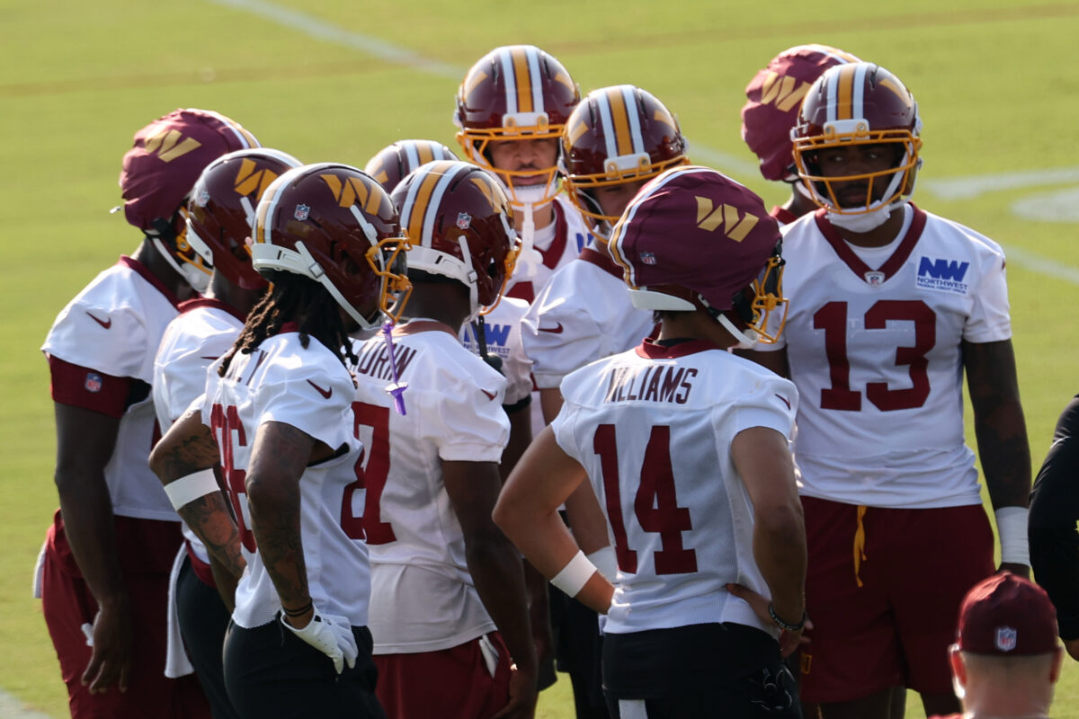 Jul 29, 2026; Ashburn, VA, USA; Washington Commanders wide receivers huddle after a drill on day one of training camp at BigBear.ai Performance Center at Commanders Park. Mandatory Credit: Geoff Burke-Imagn Images