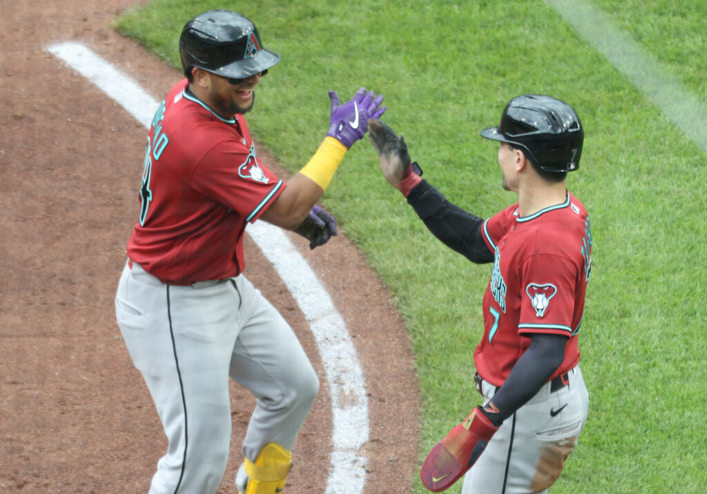 Jul 29, 2026; Pittsburgh, Pennsylvania, USA; Arizona Diamondbacks catcher Gabriel Moreno (14) celebrates his  two run home run with right fielder Corbin Carroll (7) against the Pittsburgh Pirates during the fourth inning at PNC Park. Mandatory Credit: Charles LeClaire-Imagn Images