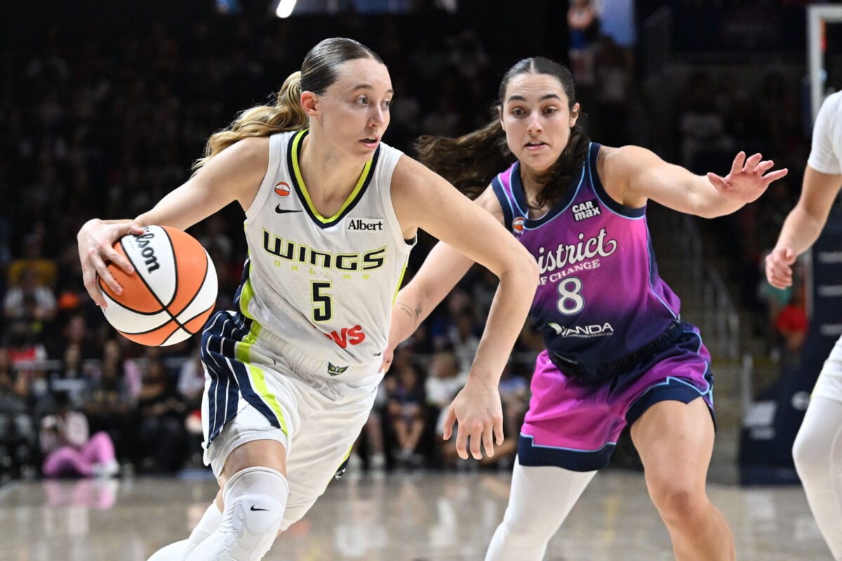 Jul 31, 2026; Washington, District of Columbia, USA; Dallas Wings guard Paige Bueckers (5) dribbles as Washington Mystics guard Georgia Amoore (8) defends at CareFirst Arena. Mandatory Credit: Brad Mills-Imagn Images