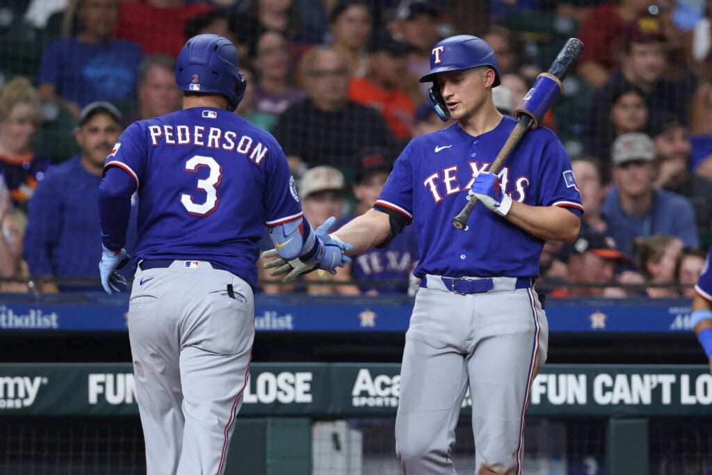 Jul 31, 2026; Houston, Texas, USA; Texas Rangers designated hitter Joc Pederson (3) celebrates with shortstop Corey Seager (5) after hitting a home run during the sixth inning against the Houston Astros at Daikin Park. Mandatory Credit: Troy Taormina-Imagn Images