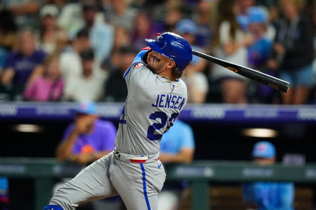 Jul 31, 2026; Denver, Colorado, USA; Kansas City Royals catcher Carter Jensen (22) hits a solo home run in the sixth inning against the Colorado Rockies at Coors Field. Mandatory Credit: Ron Chenoy-Imagn Images
