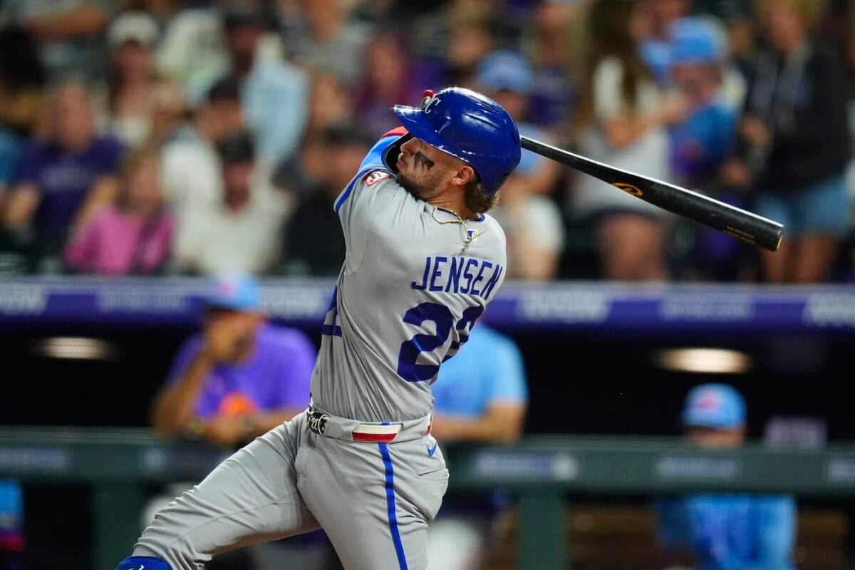 Jul 31, 2026; Denver, Colorado, USA; Kansas City Royals catcher Carter Jensen (22) hits a solo home run in the sixth inning against the Colorado Rockies at Coors Field. Mandatory Credit: Ron Chenoy-Imagn Images