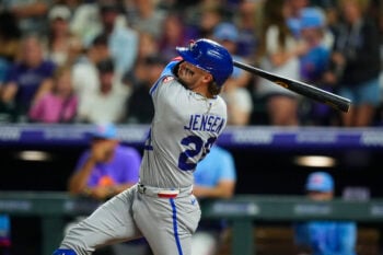 Jul 31, 2026; Denver, Colorado, USA; Kansas City Royals catcher Carter Jensen (22) hits a solo home run in the sixth inning against the Colorado Rockies at Coors Field. Mandatory Credit: Ron Chenoy-Imagn Images