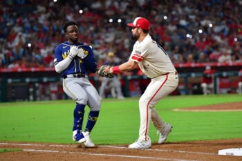 Jul 31, 2026; Anaheim, California, USA; Milwaukee Brewers right fielder Luis Lara (18) is tagged out at first by Los Angeles Angels first baseman Nolan Schanuel (18) to end the top of the seventh inning at Angel Stadium. Mandatory Credit: Gary A. Vasquez-Imagn Images