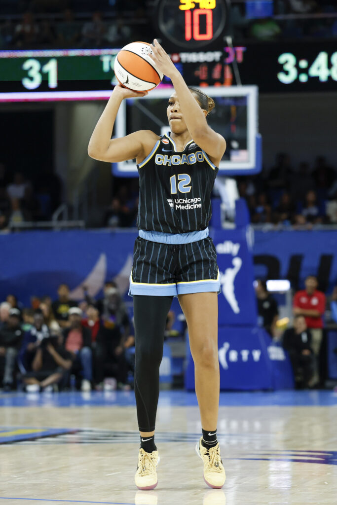 Aug 1, 2026; Chicago, Illinois, USA; Chicago Sky guard Sydney Taylor (12) shoots against the Las Vegas Aces during the first half of a WNBA game at Wintrust Arena. Mandatory Credit: Kamil Krzaczynski-Imagn Images