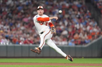 Aug 1, 2026; Baltimore, Maryland, USA; Baltimore Orioles shortstop Gunnar Henderson (2) leaps and throws to first base for an out against Philadelphia Phillies center fielder Justin Crawford (not pictured) during the fifth inning at Oriole Park at Camden Yards. Mandatory Credit: Gregory Fisher-Imagn Images