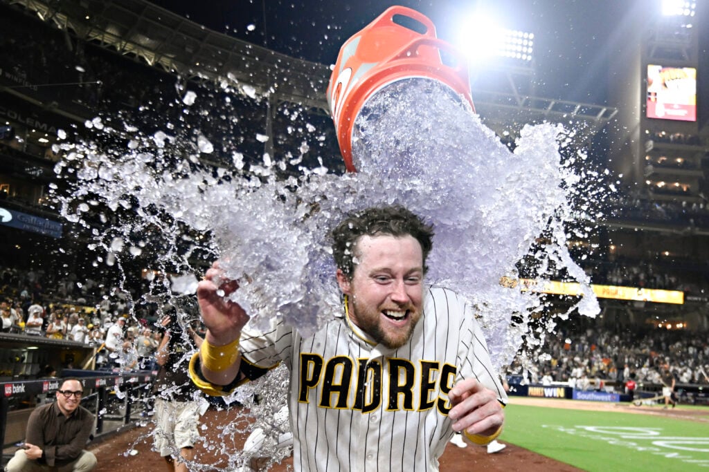 Aug 1, 2026; San Diego, California, USA; San Diego Padres second baseman Jake Cronenworth (9) has a cooler dumped over him after he hit a walk-off single during the ninth inning against the San Francisco Giants at Petco Park. Mandatory Credit: Denis Poroy-Imagn Images
