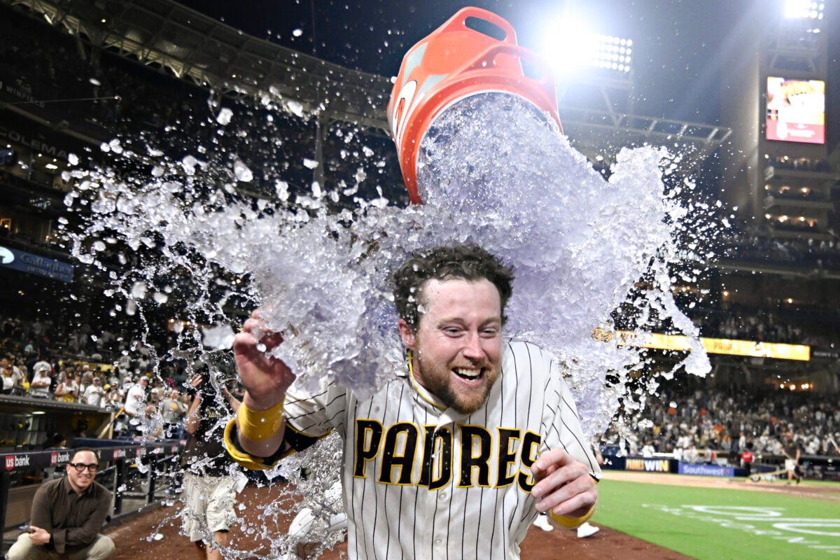 Aug 1, 2026; San Diego, California, USA; San Diego Padres second baseman Jake Cronenworth (9) has a cooler dumped over him after he hit a walk-off single during the ninth inning against the San Francisco Giants at Petco Park. Mandatory Credit: Denis Poroy-Imagn Images