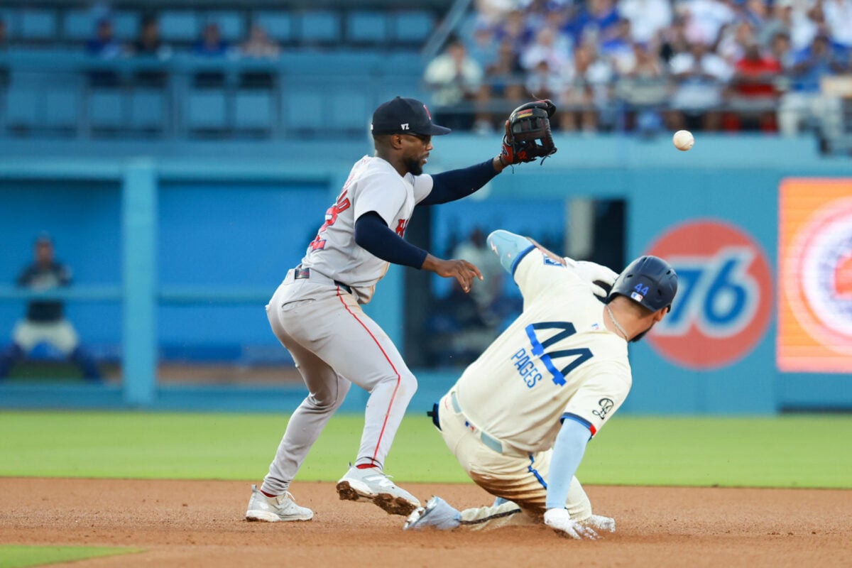 Aug 1, 2026; Los Angeles, California, USA; Los Angeles Dodgers center fielder Andy Pages (44) slides into second base in the bottom of the fifth inning against the Boston Red Sox at Dodger Stadium. Mandatory Credit: William Navarro-Imagn Images