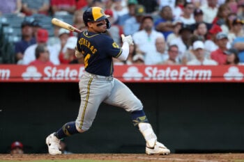 Aug 1, 2026; Anaheim, California, USA;  Milwaukee Brewers catcher William Contreras (24) hits a double during the third inning against the Los Angeles Angels at Angel Stadium. Mandatory Credit: Kiyoshi Mio-Imagn Images