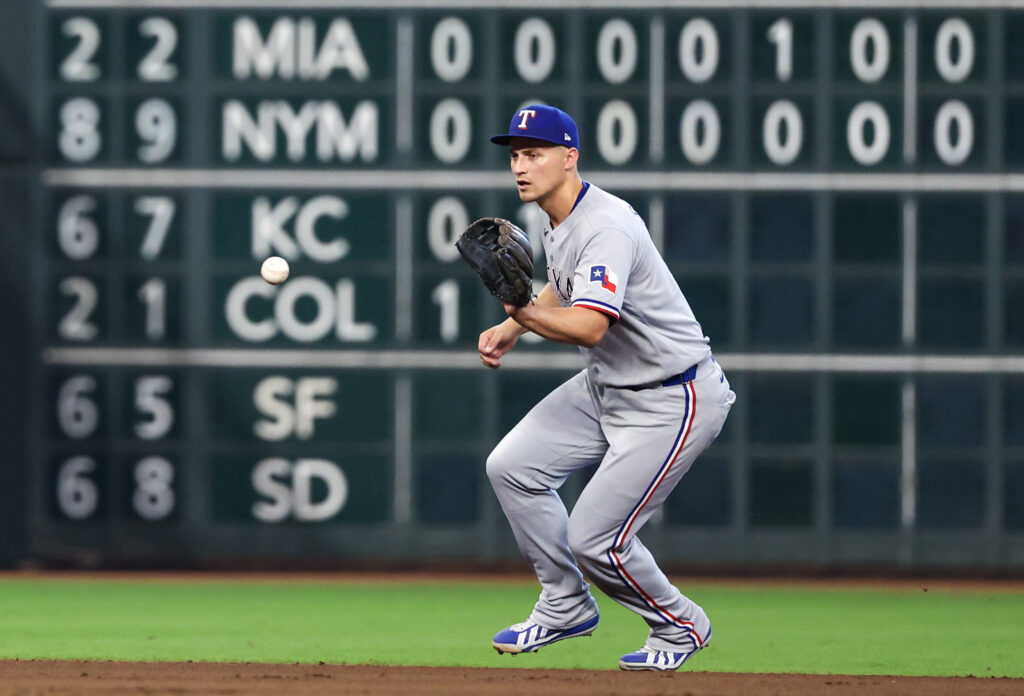 Aug 2, 2026; Houston, Texas, USA; Texas Rangers shortstop Corey Seager (5) plays Houston Astros shortstop Nick Allen (20) (not pictured) ground ball for an out  in the sixth inning at Daikin Park. Mandatory Credit: Thomas Shea-Imagn Images