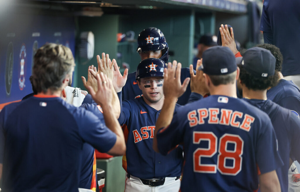 Aug 2, 2026; Houston, Texas, USA; Houston Astros shortstop Nick Allen (20) and left fielder LaMonte Wade Jr. (31) celebrate their runs in the dugout with teammates after left fielder Yordan Alvarez (44)(not pictured) hit a two run RBI double in the seventh inning at Daikin Park. Mandatory Credit: Thomas Shea-Imagn Images