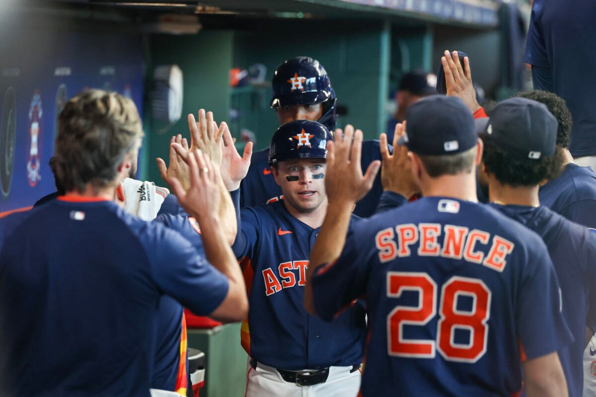 Aug 2, 2026; Houston, Texas, USA; Houston Astros shortstop Nick Allen (20) and left fielder LaMonte Wade Jr. (31) celebrate their runs in the dugout with teammates after left fielder Yordan Alvarez (44)(not pictured) hit a two run RBI double in the seventh inning at Daikin Park. Mandatory Credit: Thomas Shea-Imagn Images