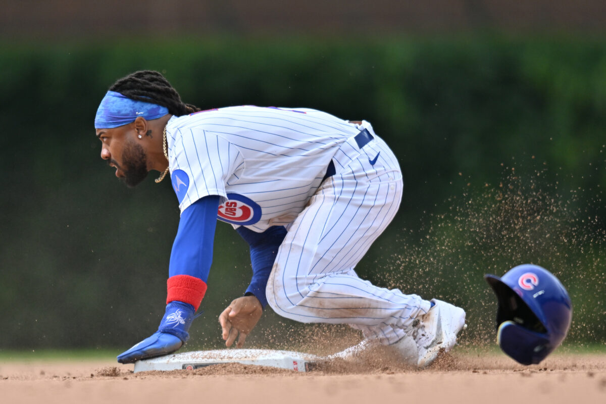 Aug 2, 2026; Chicago, Illinois, USA; Chicago Cubs pinch runner Justin Dean (1) looks up after stealing second base against the New York Yankees during the eighth inning at Wrigley Field. Mandatory Credit: Patrick Gorski-Imagn Images