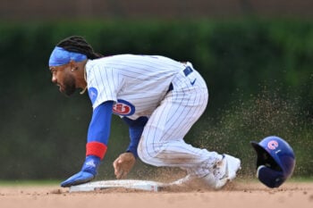 Aug 2, 2026; Chicago, Illinois, USA; Chicago Cubs pinch runner Justin Dean (1) looks up after stealing second base against the New York Yankees during the eighth inning at Wrigley Field. Mandatory Credit: Patrick Gorski-Imagn Images