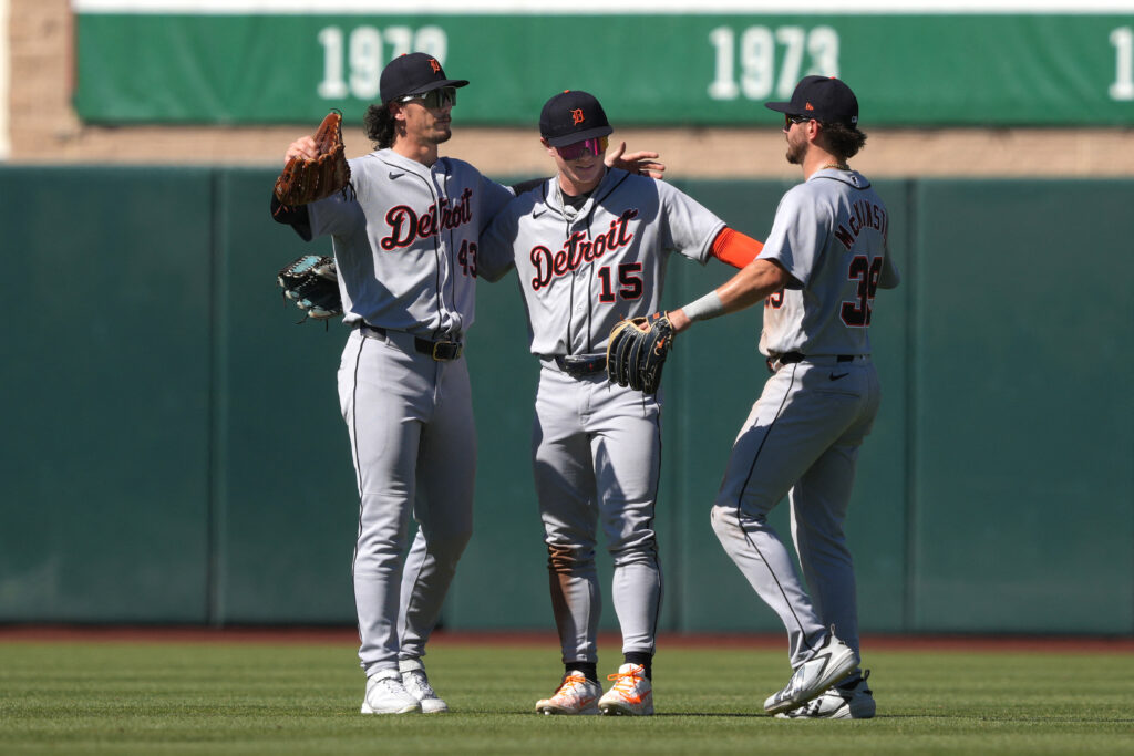 Aug 2, 2026; West Sacramento, California, USA; Detroit Tigers center fielder Max Clark (15) celebrates with left fielder James Outman (43) and right fielder Zach McKinstry (right) after defeating the Athletics at Sutter Health Park. Mandatory Credit: Darren Yamashita-Imagn Images
