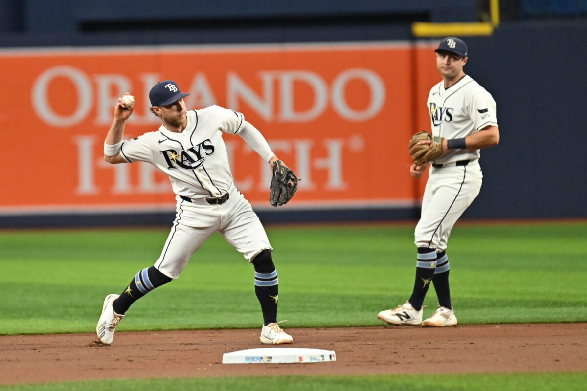 Jul 29, 2026; St. Petersburg, Florida, USA; Tampa Bay Rays shortstop Taylor Walls (6) throws to first base in the first inning against the Texas Rangers at Tropicana Field. Mandatory Credit: Jonathan Dyer-Imagn Images