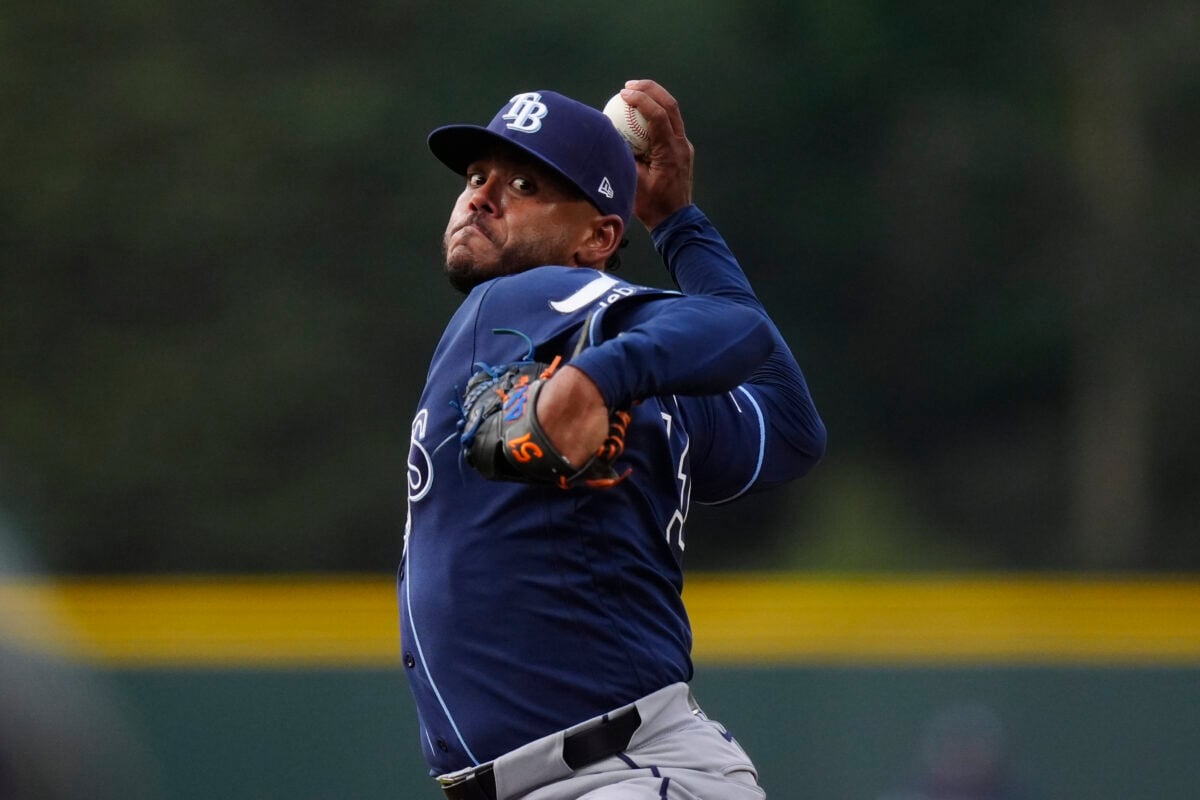 Aug 4, 2026; Denver, Colorado, USA; Tampa Bay Rays starting pitcher Freddy Peralta (51) delivers a pitch in the first inning against the Colorado Rockies at Coors Field. Mandatory Credit: Ron Chenoy-Imagn Images