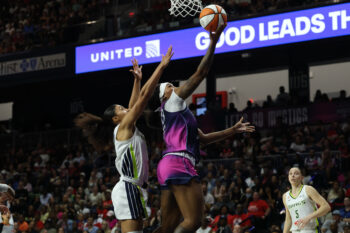 Aug 5, 2026; Washington, District of Columbia, USA; Washington Mystics forward Kiki Iriafen (44) shoots the ball as Dallas Wings guard Azzi Fudd (35) defends in the second half at CareFirst Arena. Mandatory Credit: Geoff Burke-Imagn Images
