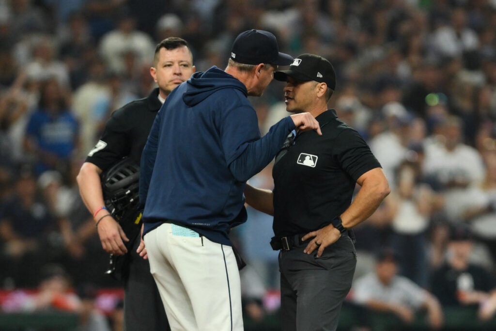 Aug 5, 2026; Seattle, Washington, USA; Seattle Mariners manager Dan Wilson reacts to being ejected by umpire Mark Wegner (14) during the eighth inning against the Detroit Tigers at T-Mobile Park. Mandatory Credit: Steven Bisig-Imagn Images
